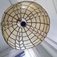 Mother-of-pearl and brass suspension