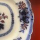 Large hollow dish in fine earthenware with Japanese decoration.
