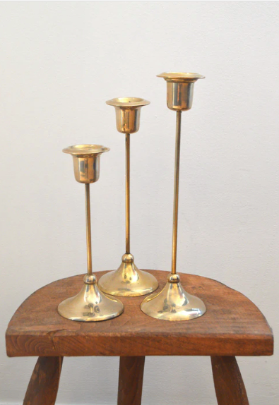 Trio of brass candlesticks