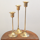 Trio of brass candlesticks