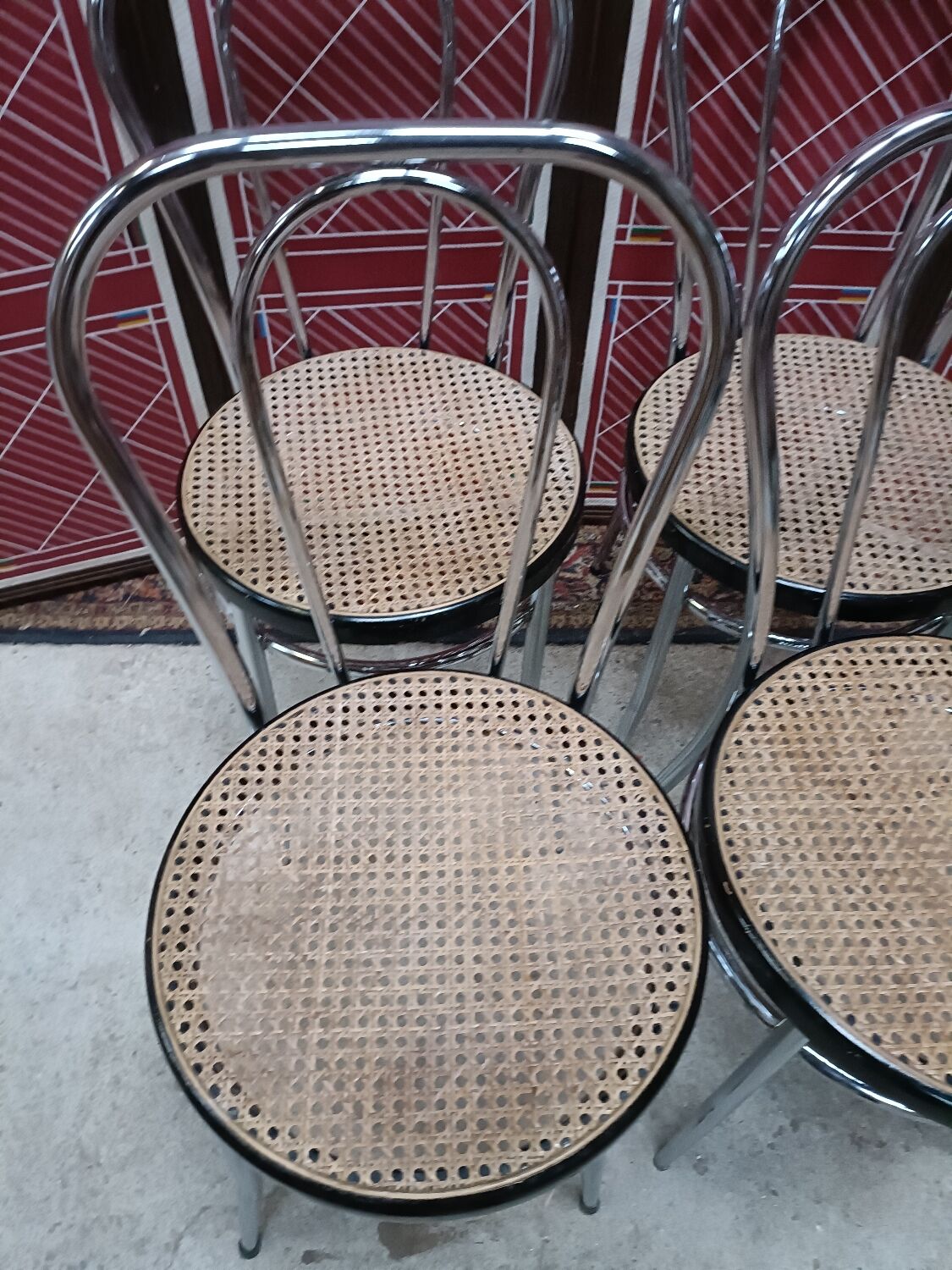 4 chaises bistrot en acier chromé et assise cannée
