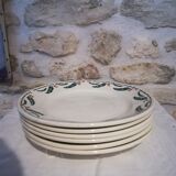 Six flat earthenware plates decorated with holly