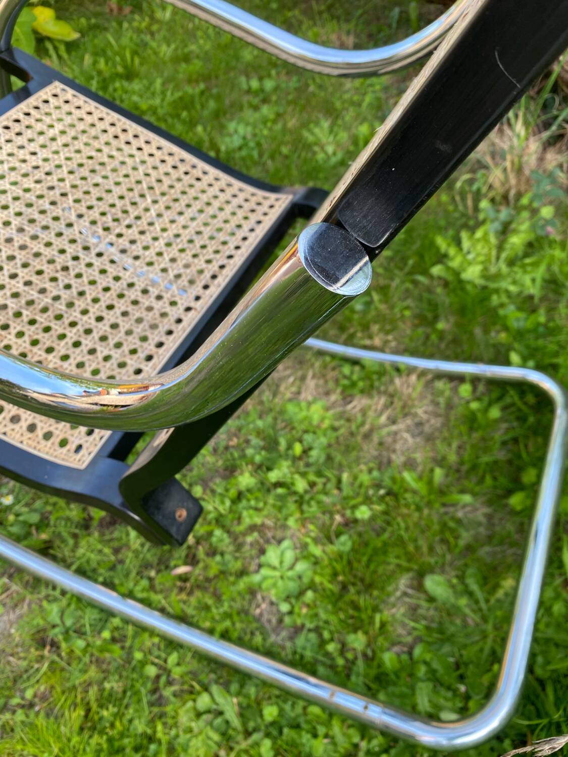 Chrome and cane rocking chair