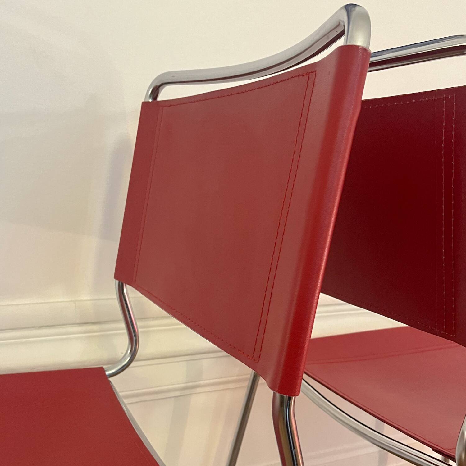 Set of 4 chairs in red leather and chrome tubular metal