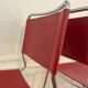 Set of 4 chairs in red leather and chrome tubular metal