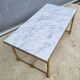 Hollywood Regency style coffee table • marble and brass