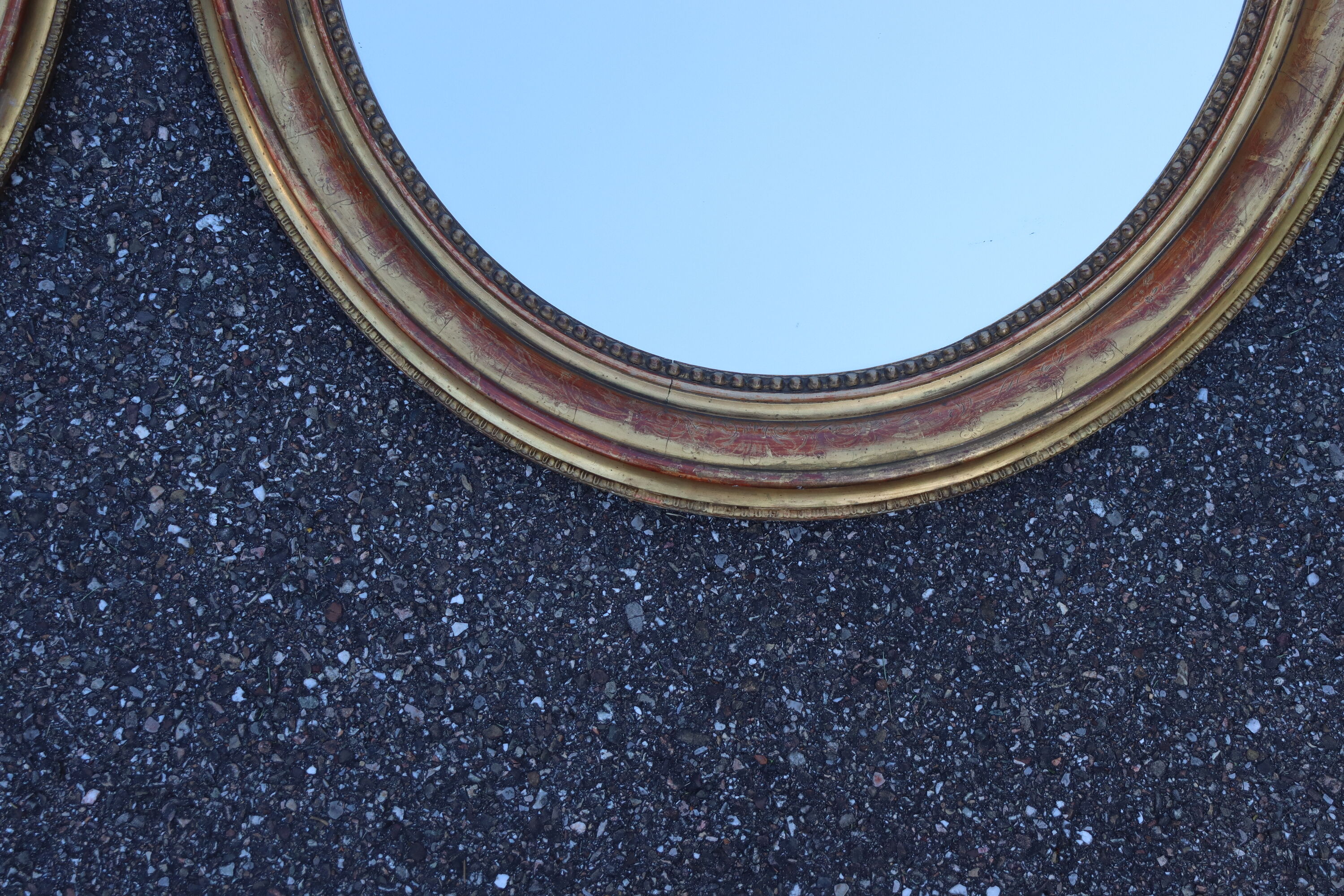 Pair of oval mirrors from the Louis Philippe period in gilded wood.