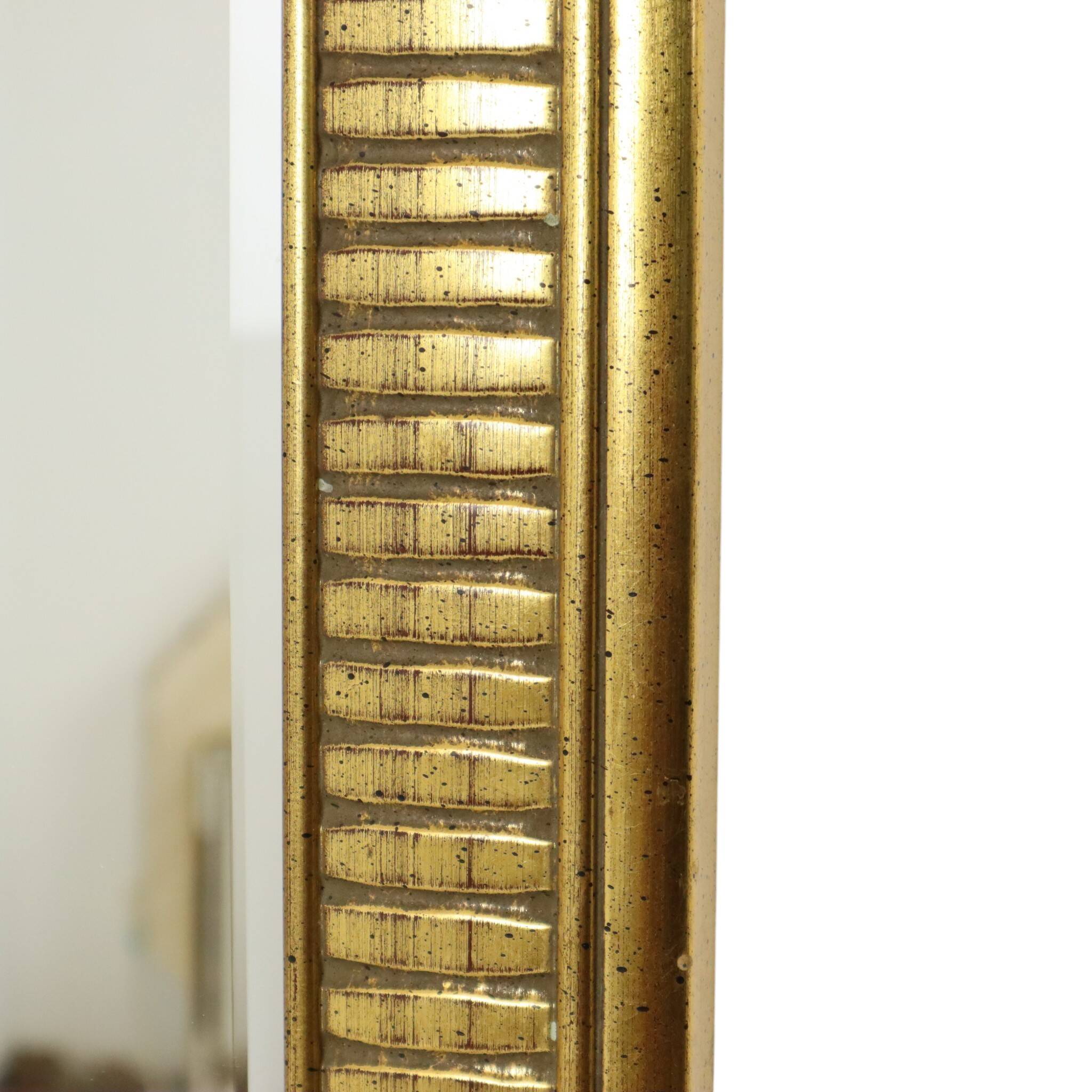 Miroir Deknudt en or Hollywood Regency biseauté 92 cm
