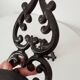 Antique wall candle holder in enamelled cast iron