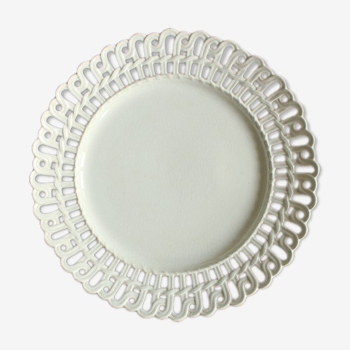 White openwork plate old white iron earth