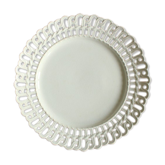 White openwork plate old white iron earth