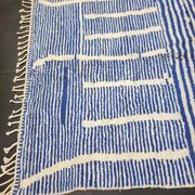 Handwoven Berber rug in blue and white, size 150x250 cm.