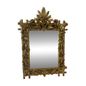 Louis XVI style mirror in carved wood and gilded with gold leaf, 19th century