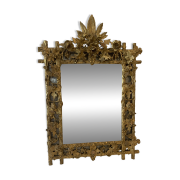 Louis XVI style mirror in carved wood and gilded with gold leaf, 19th century