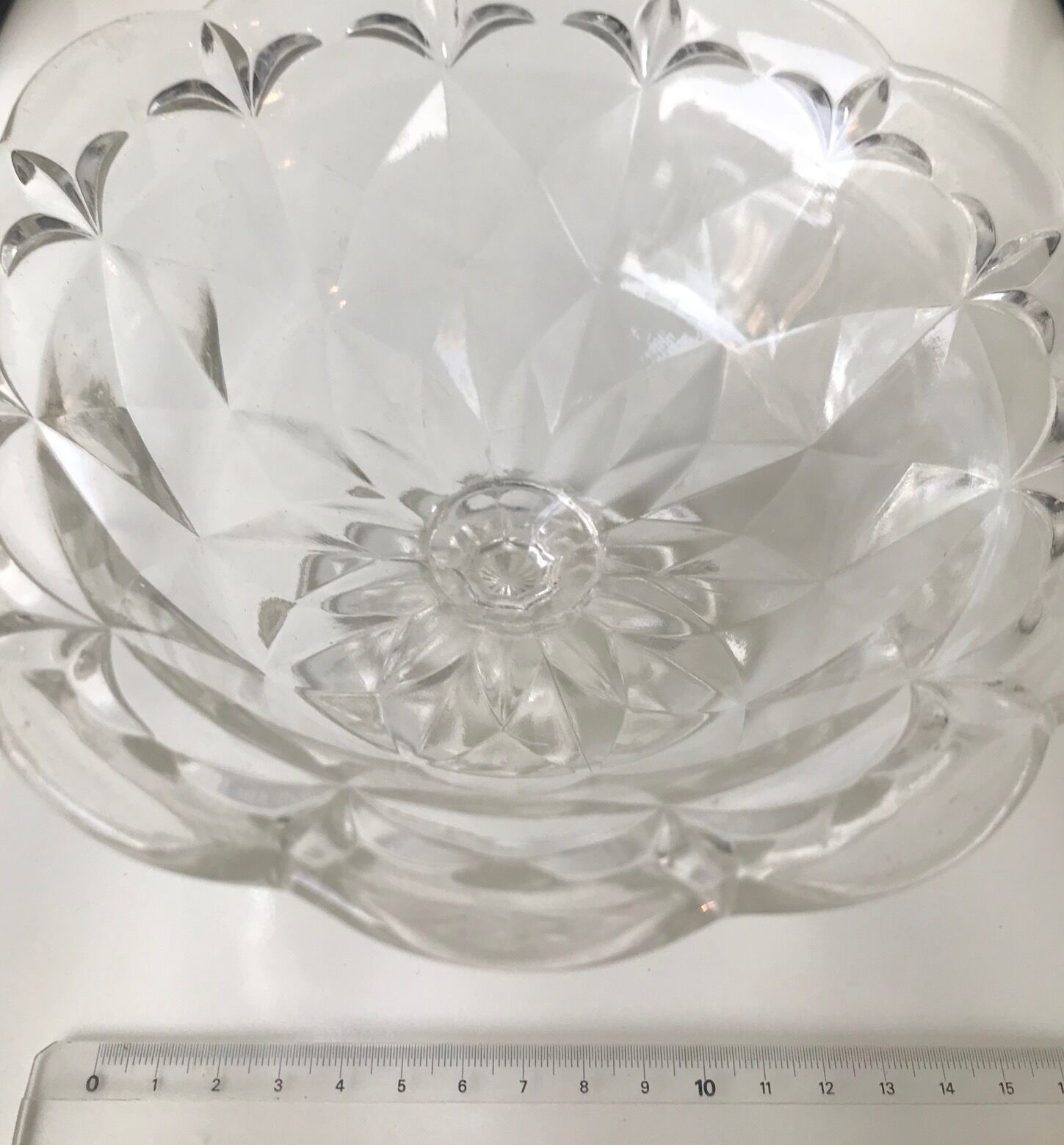 Old cut on foot faceted glass