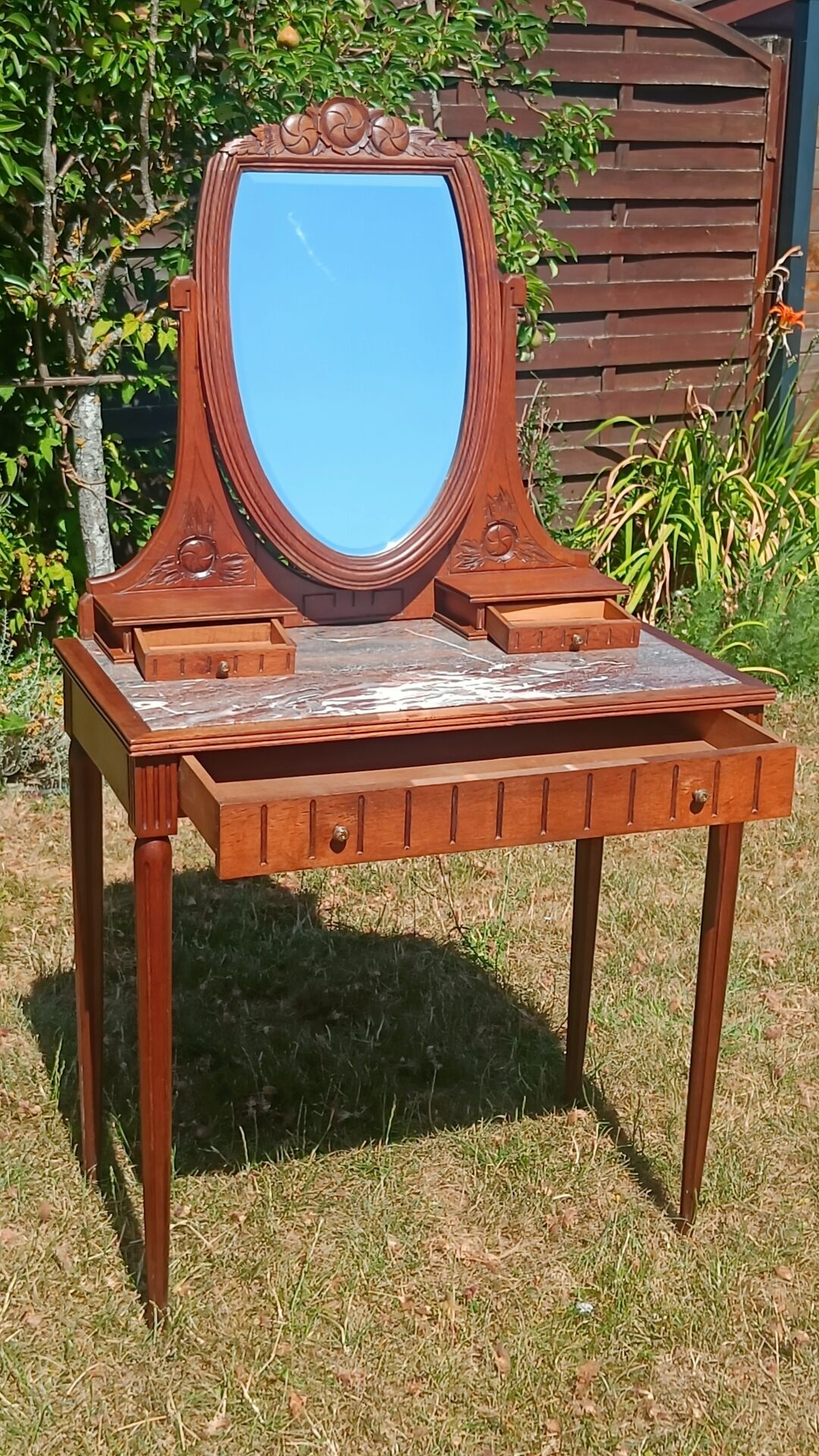 Art Deco oak dressing table, marble top and swivel mirror.