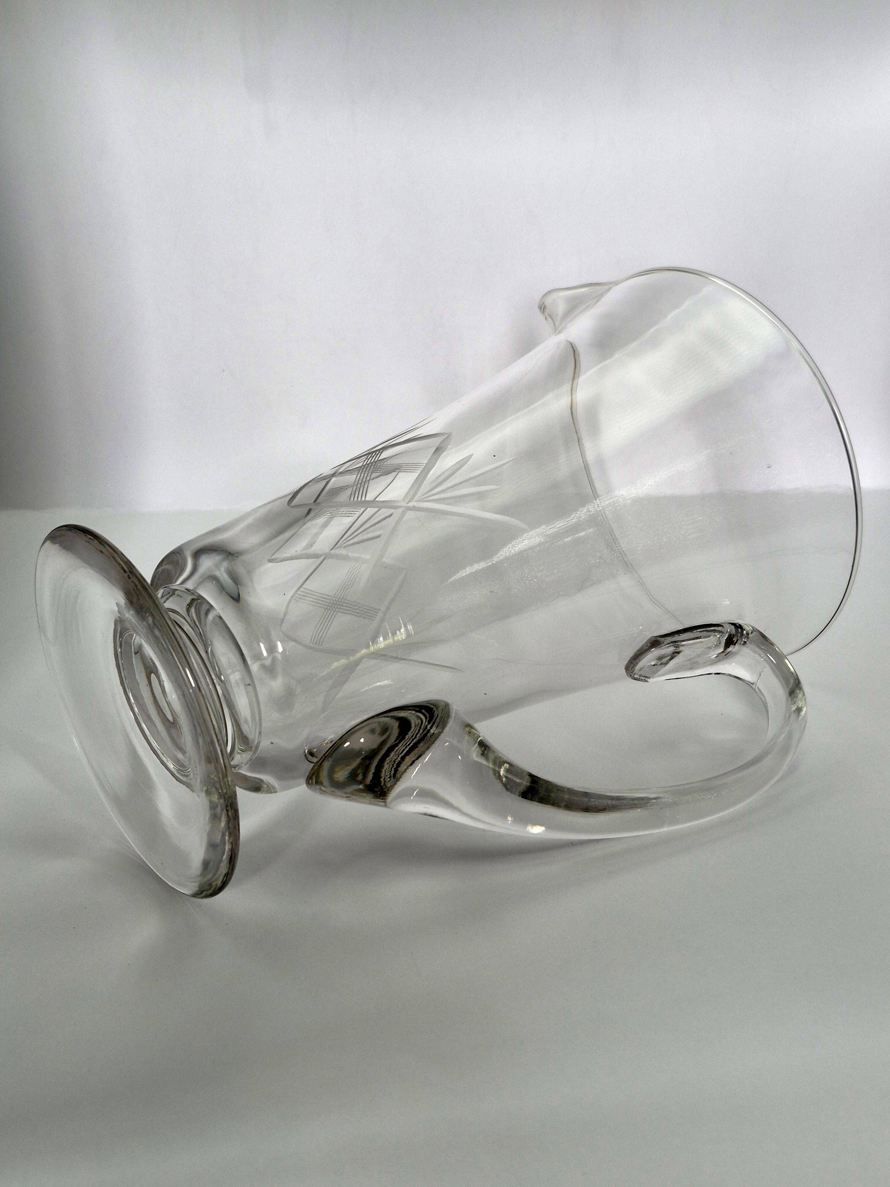 Crystal service from Fains, matching wine carafe and water jug.