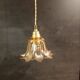 Amber tulip glass portable lamp, golden braided cord.