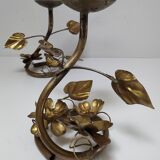 Pair of brass candle holders decorated with patinated metal flowers