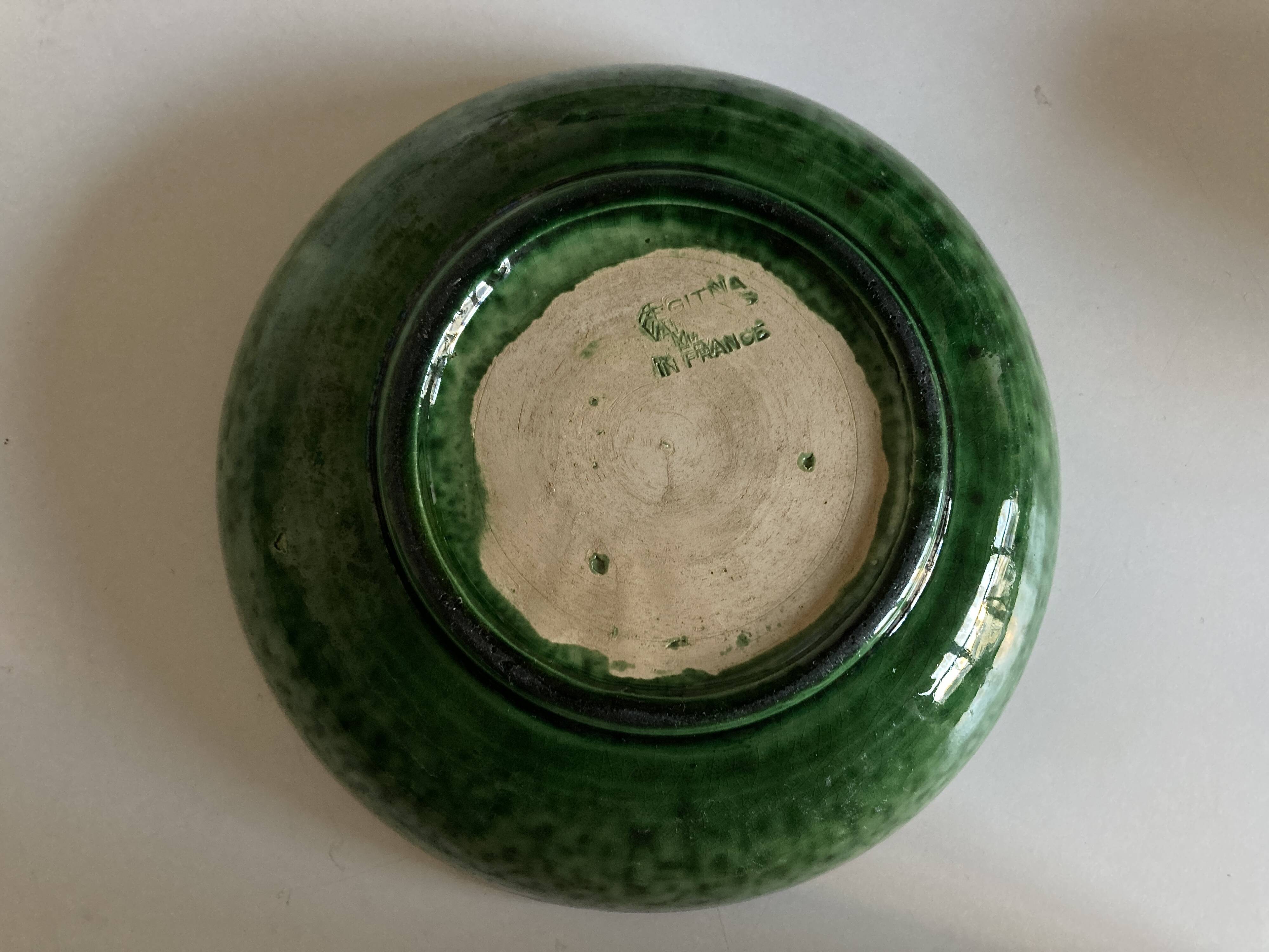 Aegitna hollow dish on heel in green glazed earthenware