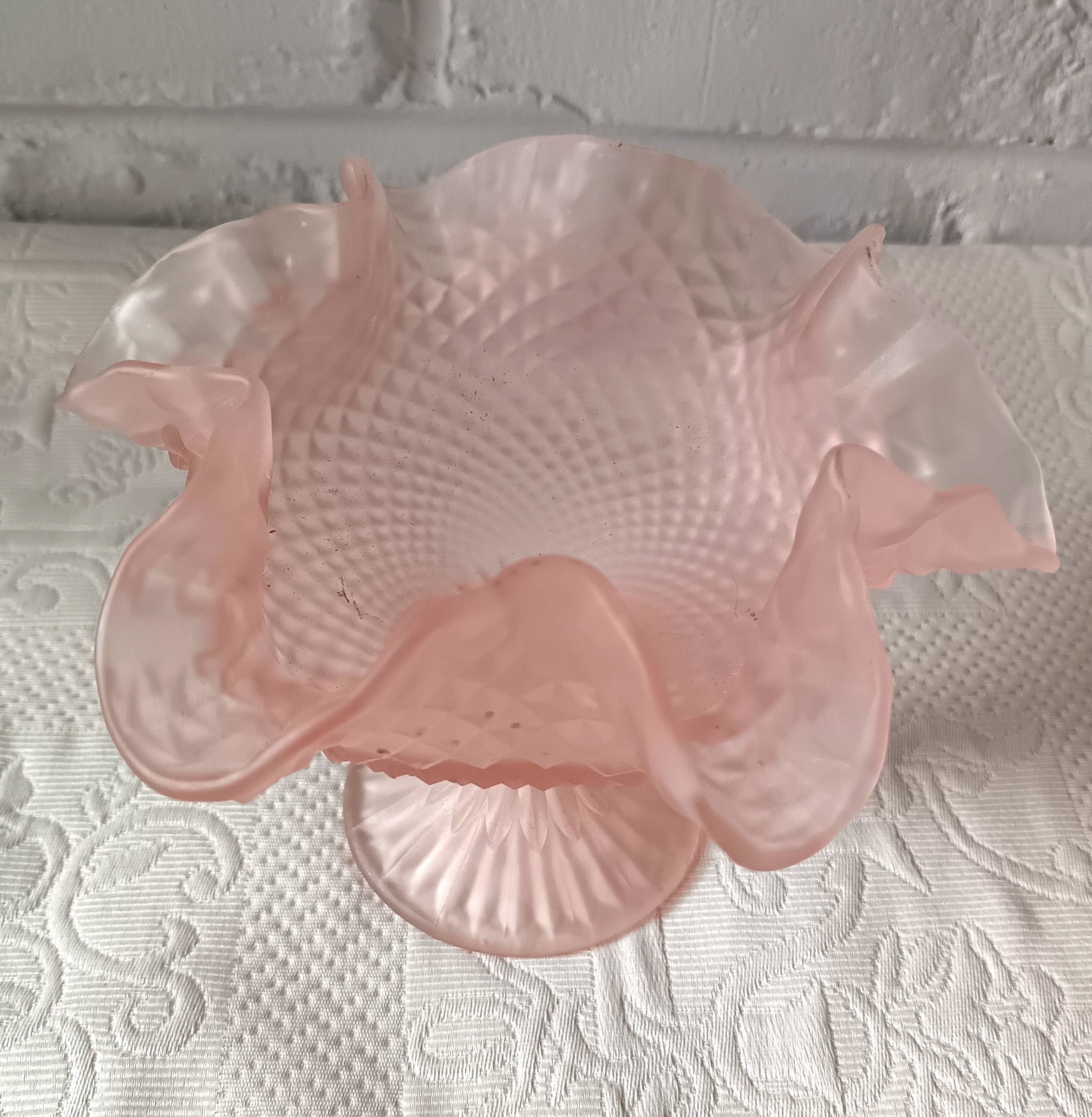 Small pink glass bowl on shabby foot, empty pocket