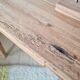 Small old farmhouse table in raw wood.