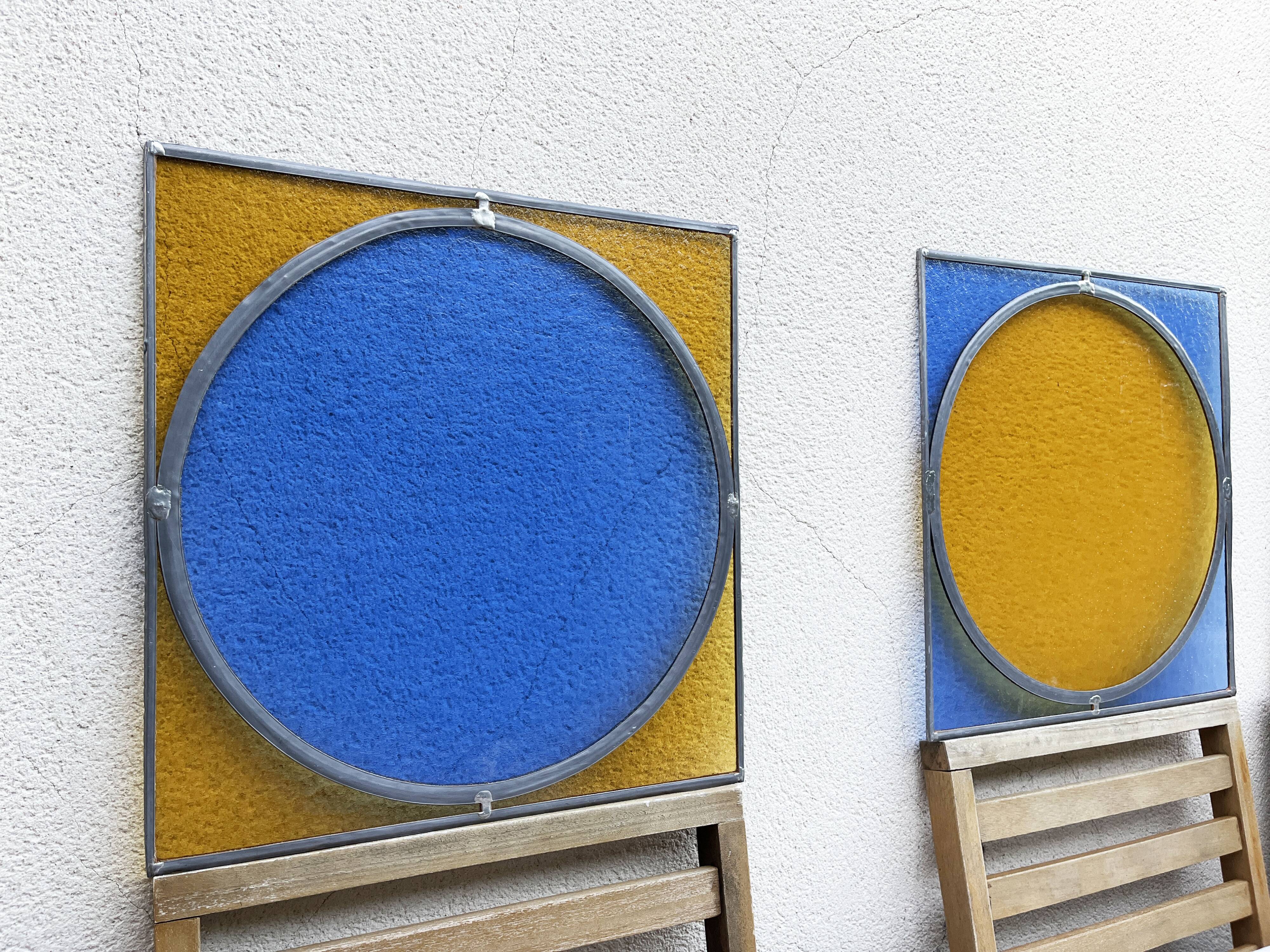 Pair of antique blue and yellow stained glass windows