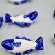 Set of 11 vintage blue and white porcelain fish knife rests.