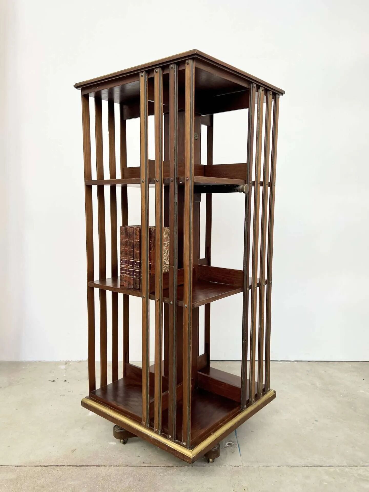 Rotating mahogany and brass library — G. Borgeaud, circa 1900