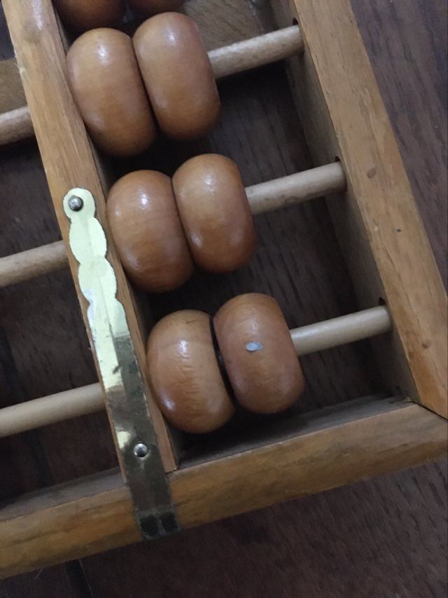 Vintage abacus made of light wood.