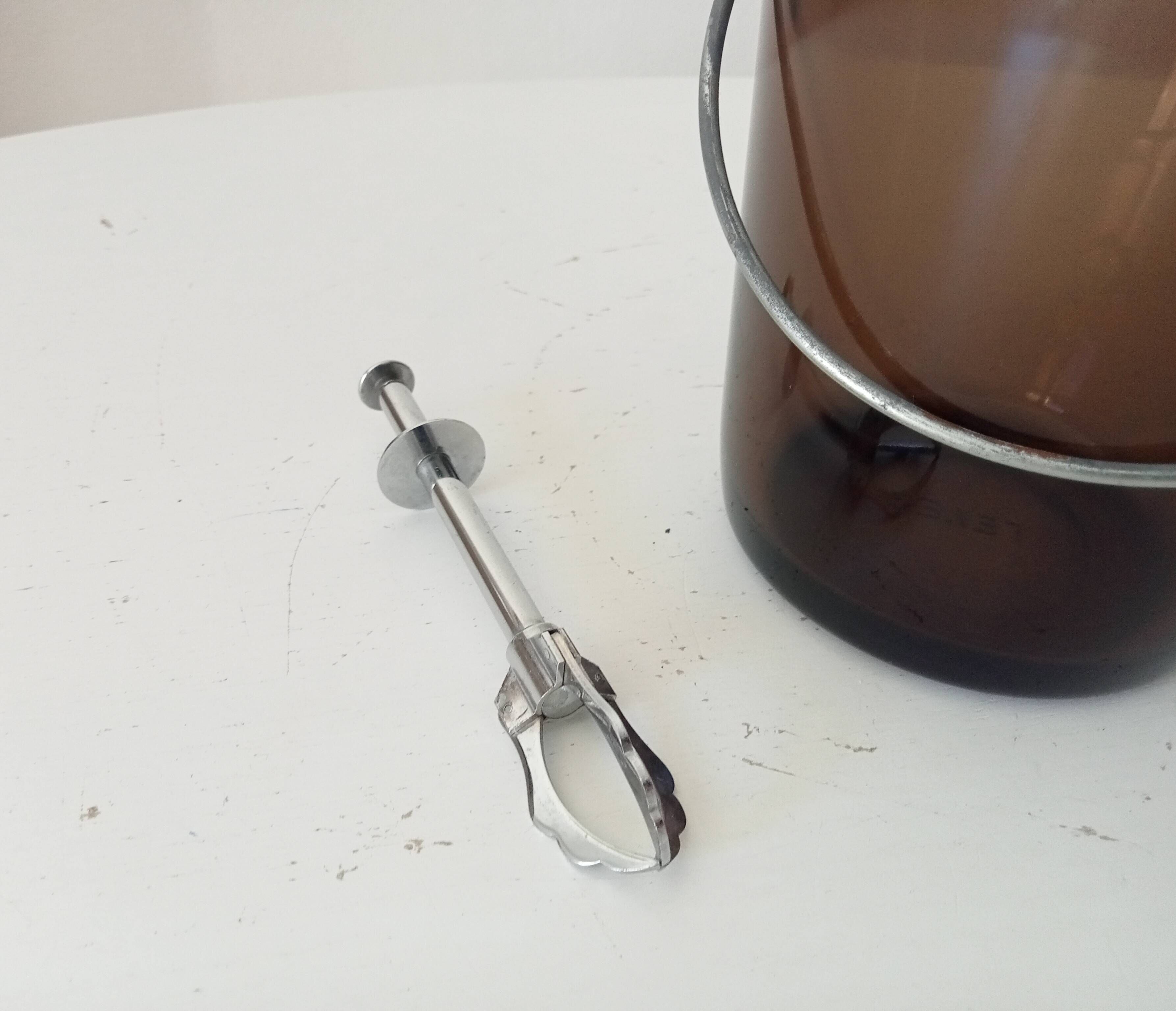 Vintage 1970s ice bucket and tongs.
