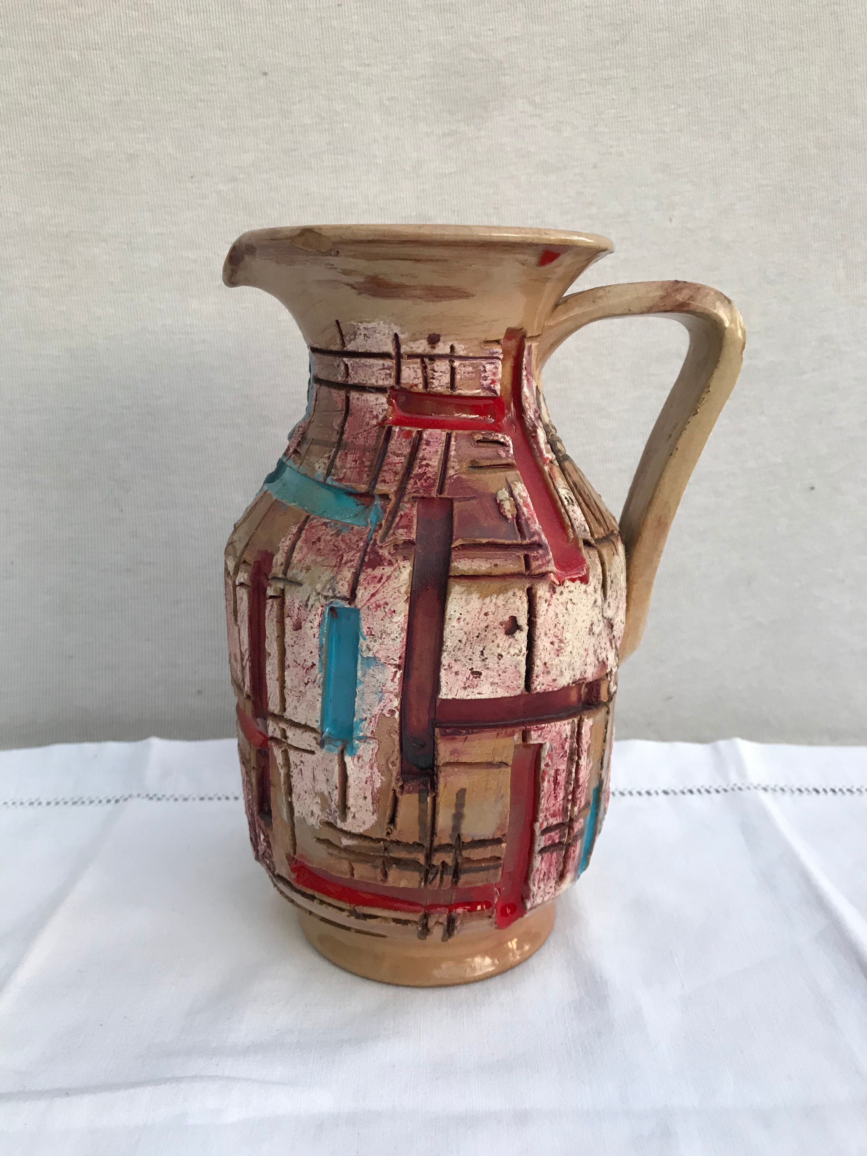 Former beige ceramic pitcher