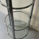 Round tubular bookcase in chrome and glass, 1970 design