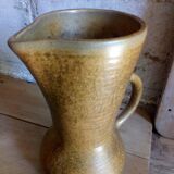 Vintage pitcher with enamelled earth cove
