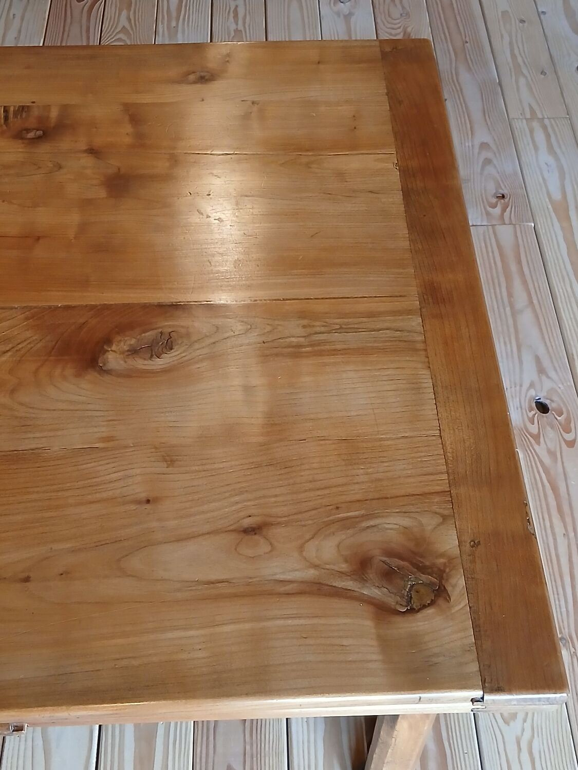 Elm farmhouse table with extensions for 6 to 10 people.