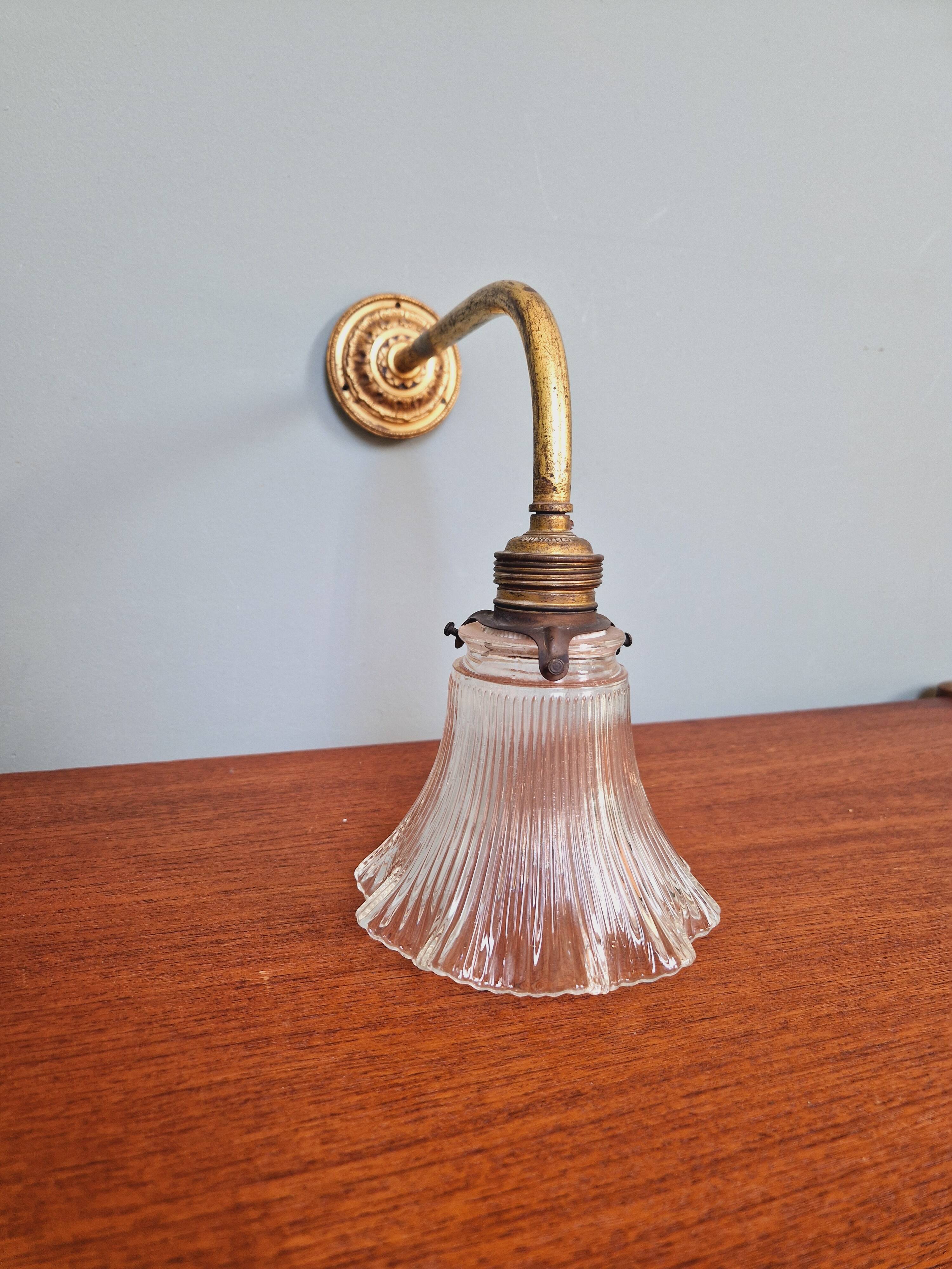 Bronze wall light with grooved clear glass, early 20th century