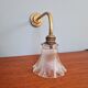 Bronze wall light with grooved clear glass, early 20th century