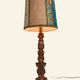 Renaissance table lamp in polychrome carved wood with cherubs.