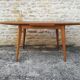 Oak table has two vintage extensions
