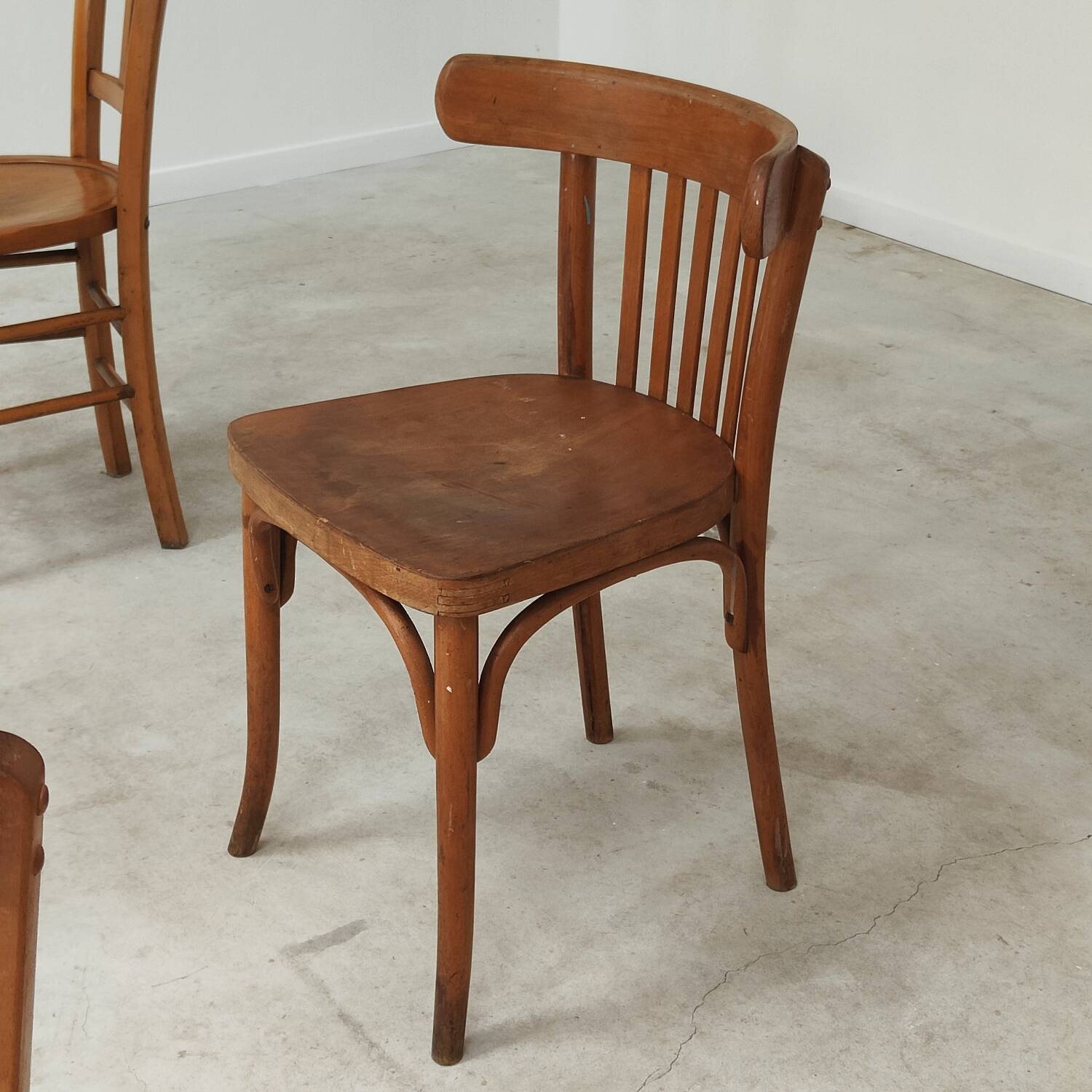 Set of 6 mismatched blond wood bistro chairs
