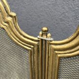 Antique brass fireplace screen from 1920, vintage spark guard.