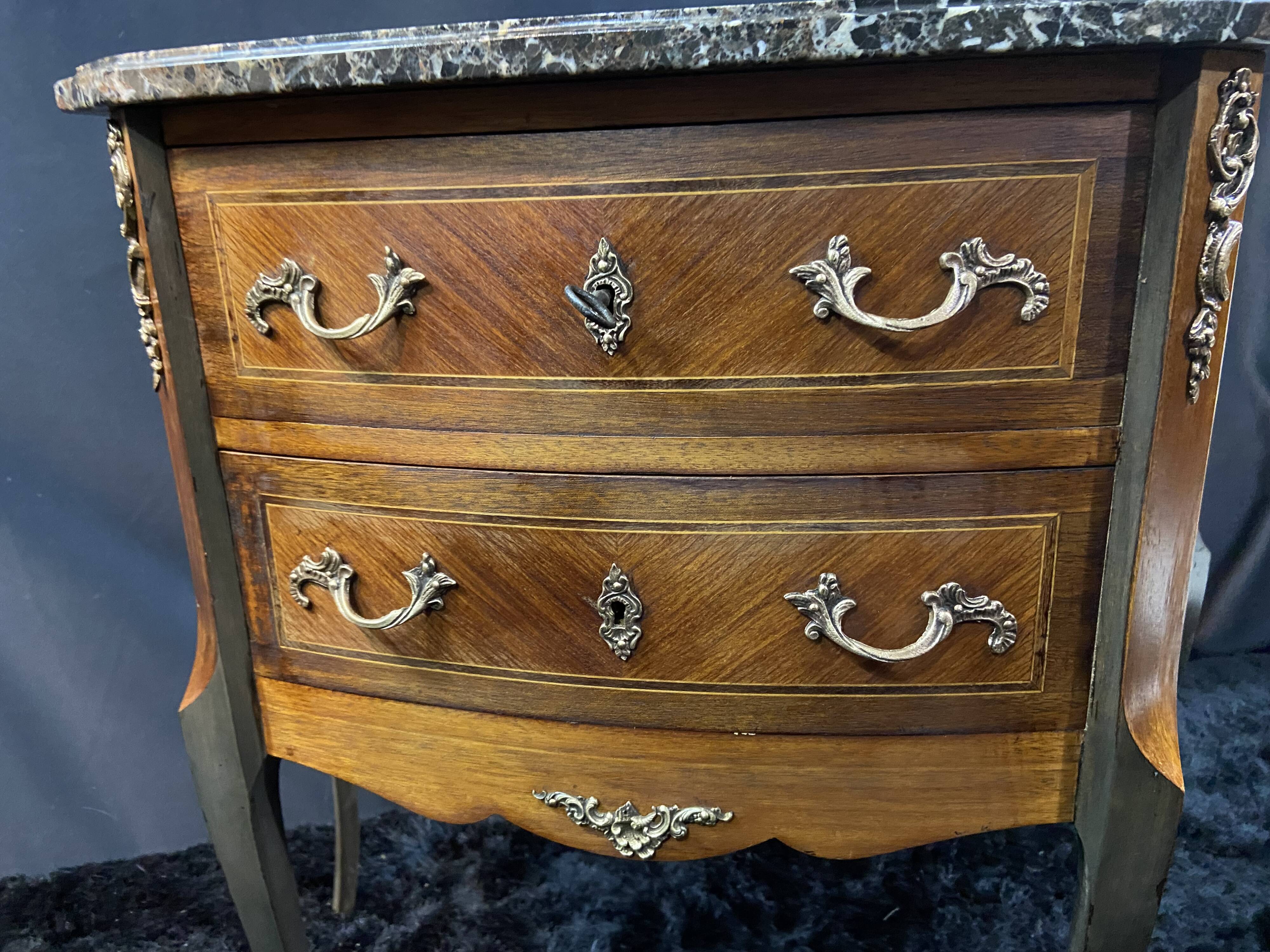 Small Louis XV style half-moon commode with marquetry and bronze decoration