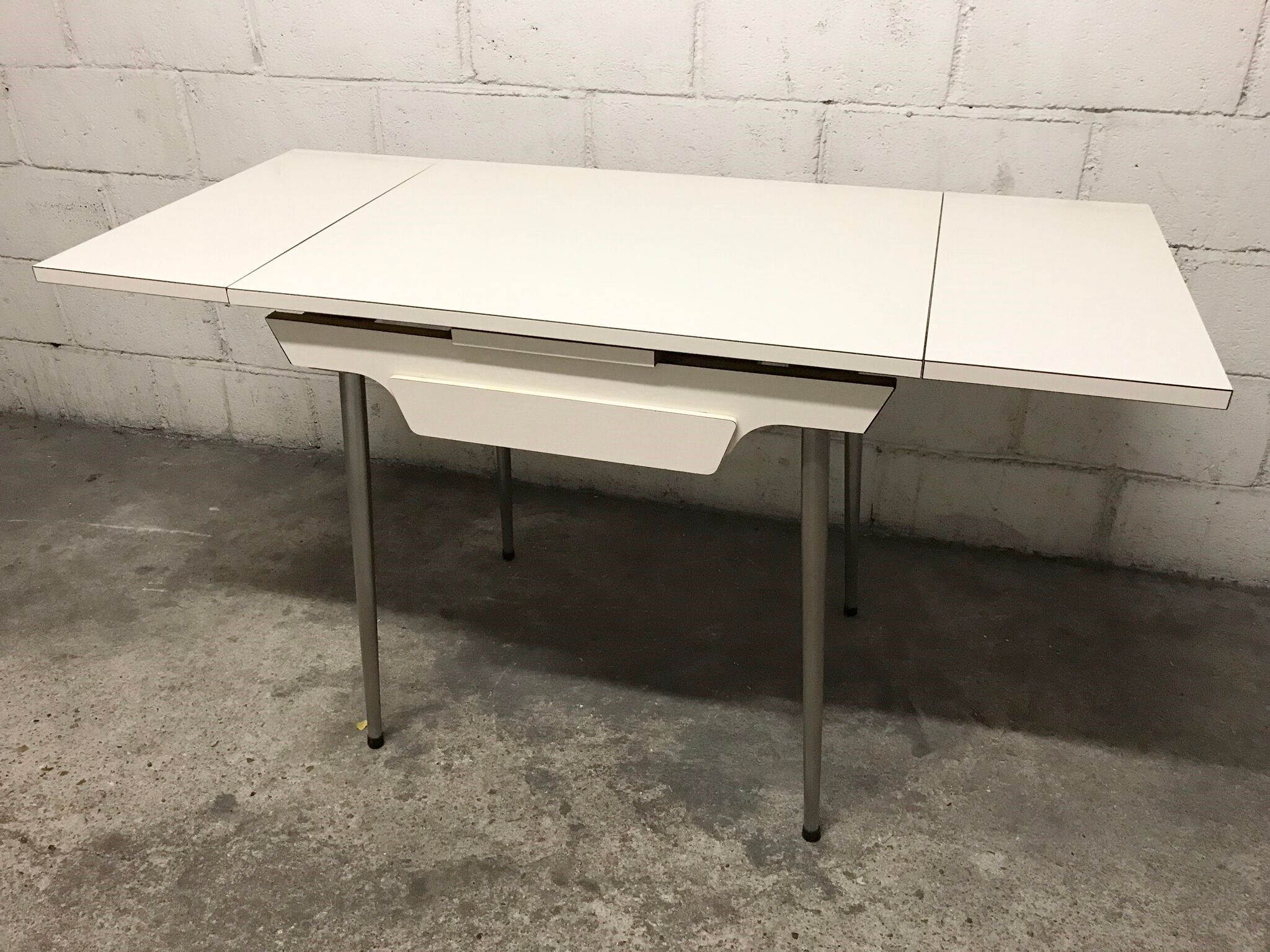 Off-white formica table / 70s cream with a tapered foot drawer