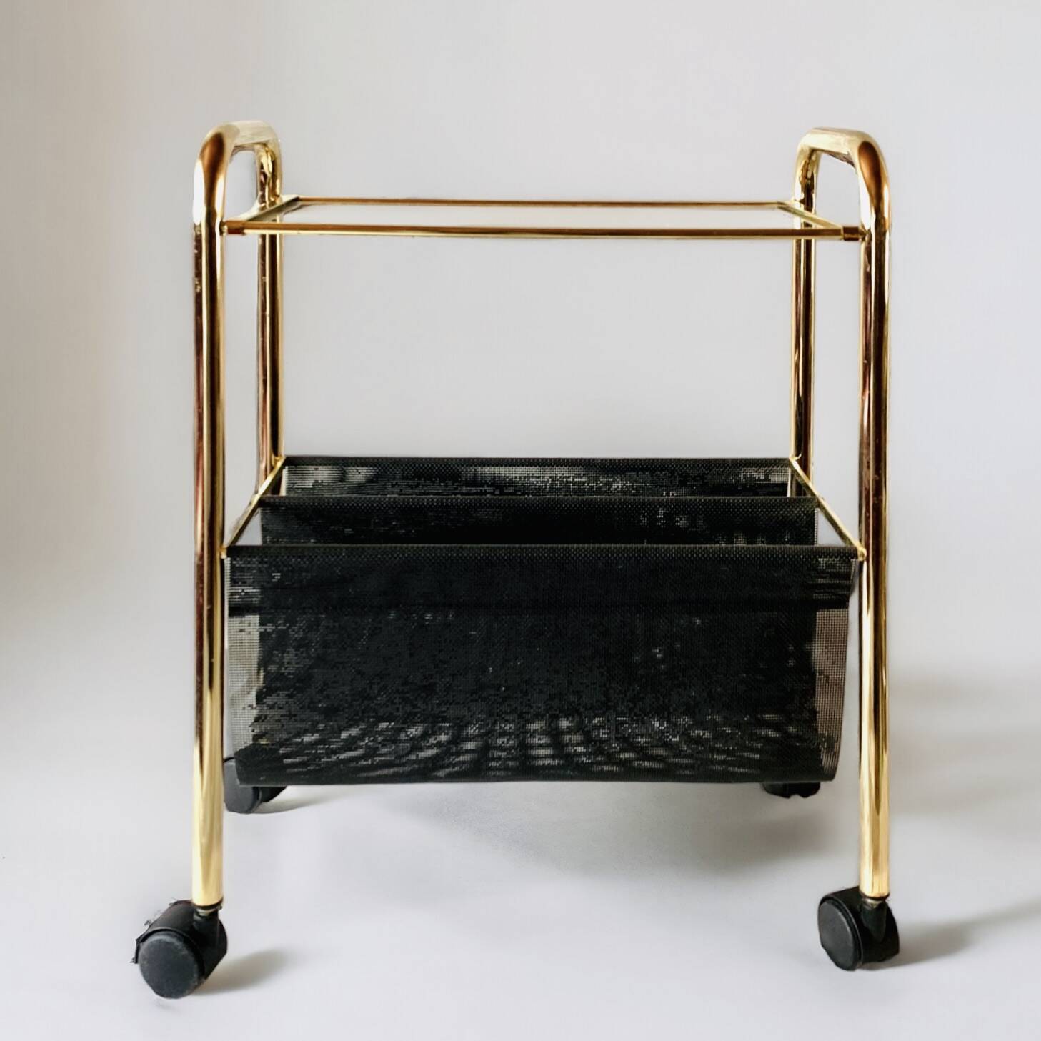 Magazine rack, saddle on vintage wheels