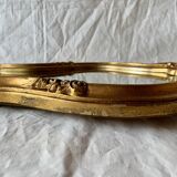 Large rococo mirror in gilded wood