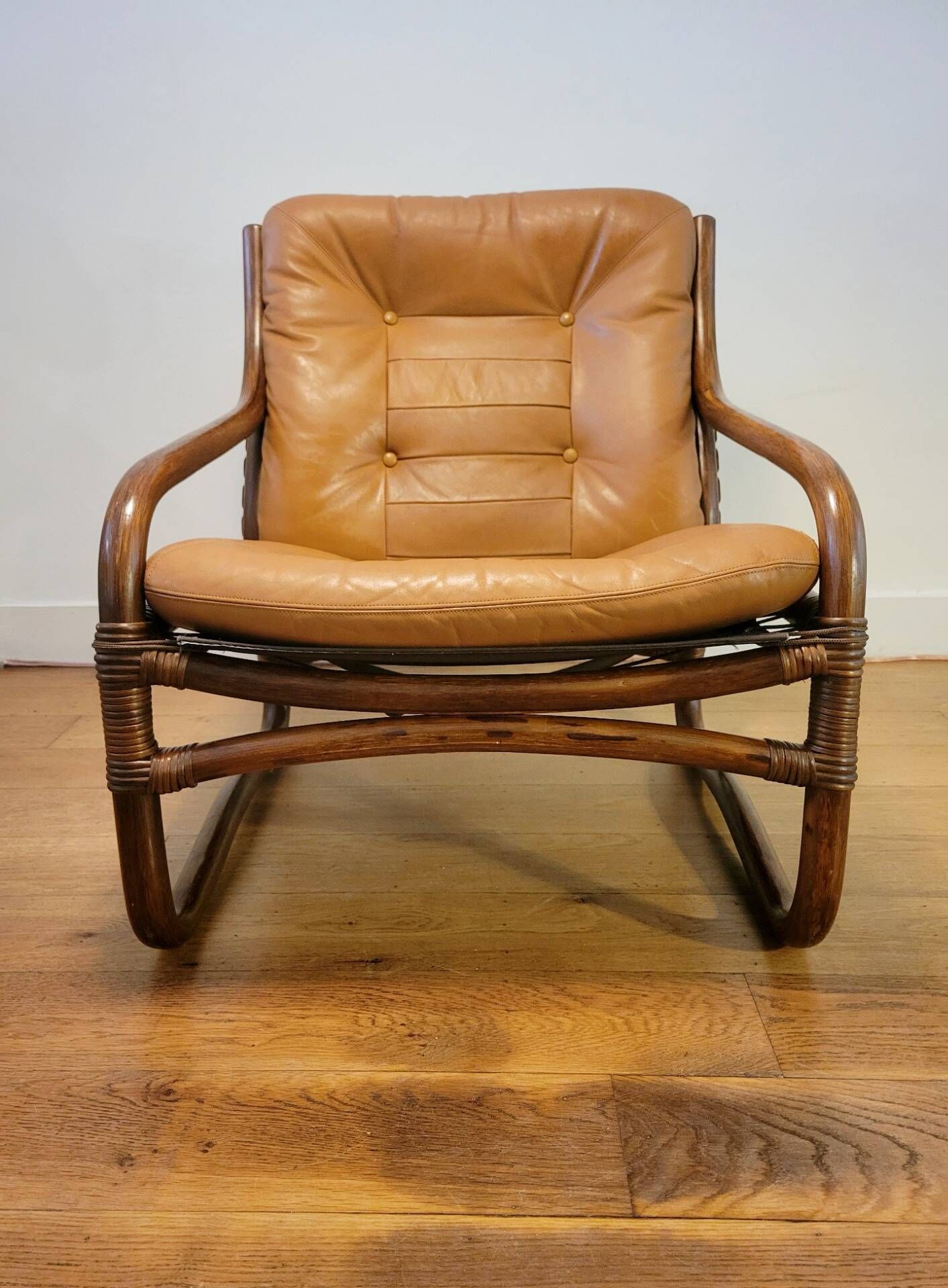 Vintage rattan armchair with leather cushions from 1970