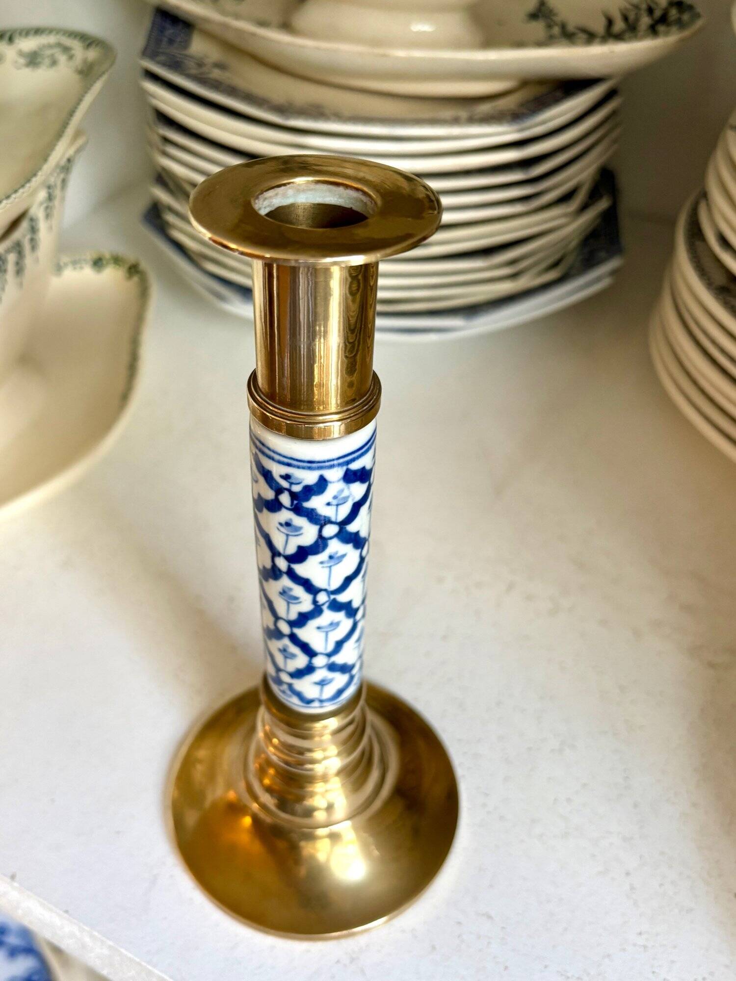 Candlestick in gilded brass and blue earthenware