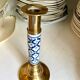 Candlestick in gilded brass and blue earthenware