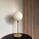 Table lamp with a lampshade from an old vintage pendant light in ribbed white glass and a pi