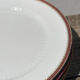 6 flat plates in gilded porcelain and burgundy